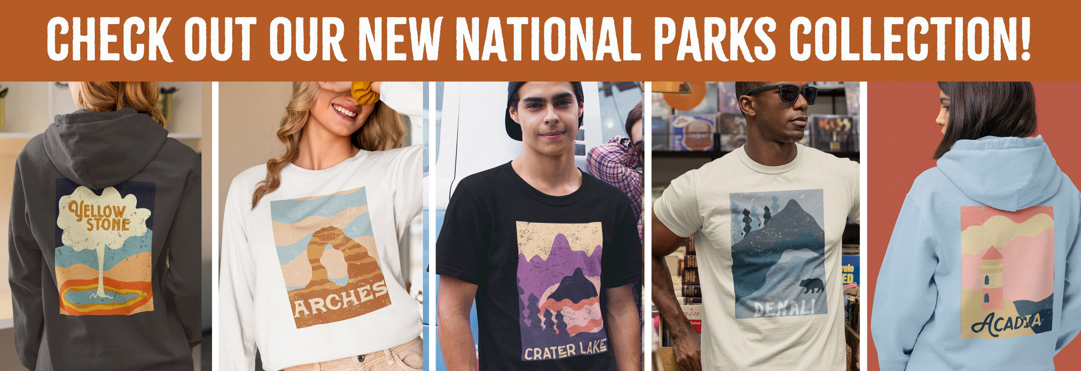 Collection of t-shirts and hoodies with national park designs displayed in a store setting.